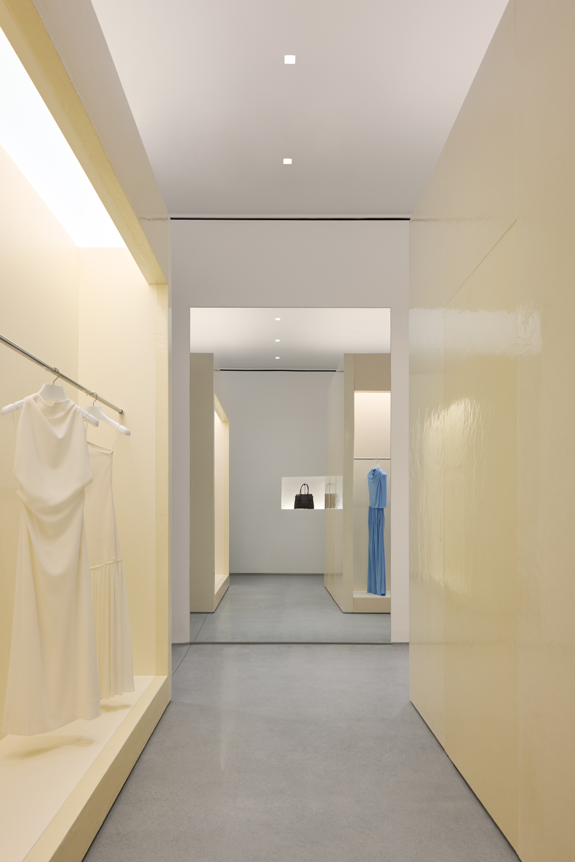 Interior hallway space showing coats at Proenza schouler, ny